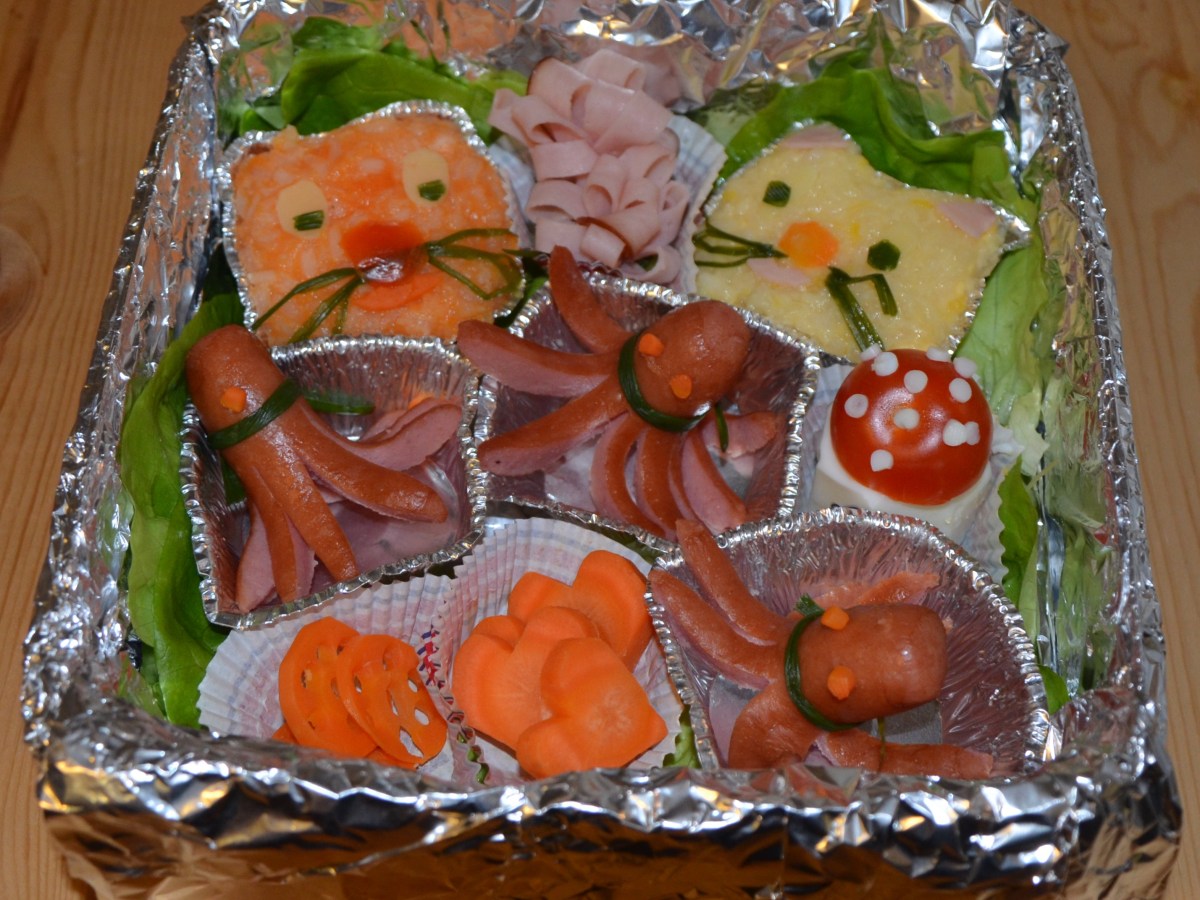 Octopus sausages, colored rice and carved carrots for the Japanese Bento&nbsp;Box